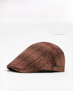 Detail of dark red flat cap with white stripes and metallic adjustable buckle strap