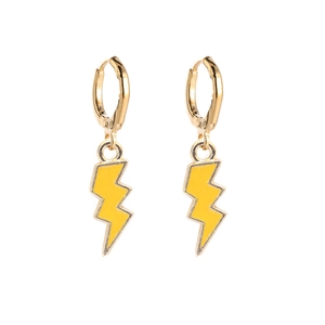 Fashionable gold earrings with yellow lightning bolt pendants on a white background
