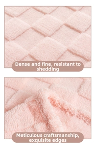 Detail of pink waffle weave blanket showing dense texture and reinforced hemmed edges