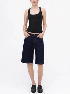 Slim fit black tank top paired with denim shorts and loafers for a casual look