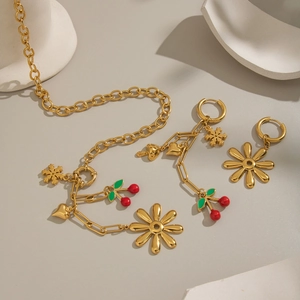 Elegant 18K gold floral and cherry jewelry set including necklace and hoop earrings