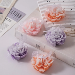 Carnation flower scented candles in pink, purple and orange with ribbon gift decor