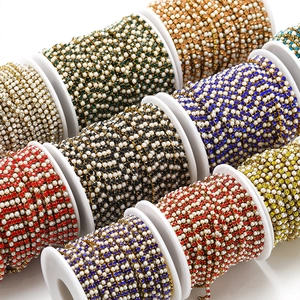Macro shot of colorful rhinestone and pearl chain rolls for DIY jewelry and crafts