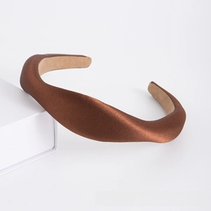 Detail showing the brown satin padded headband with premium non-slip inner lining texture
