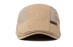 Detail of light khaki mesh flat cap showing breathable fabric and side logo patch
