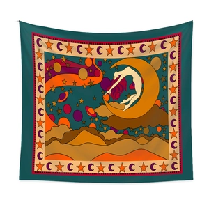 Detail of bohemian tapestry featuring artistic celestial moon, stars, and figure pattern