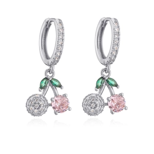 Detail of silver cherry earrings with green zircon leaves and pink crystal stone