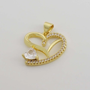 Macro view of 18K gold plated heart pendant with micro-set cubic zirconia stones