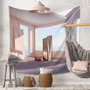 Detail of bohemian tapestry with surreal 3D pink landscape hanging on a white textured wall