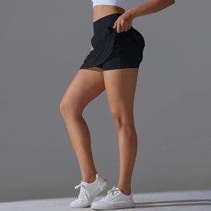 Detail view of high waisted black tennis skirt showing side profile and double layer design