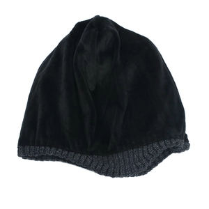 Close-up of winter knit hat featuring dual-tone black plush fabric and grey ribbed texture