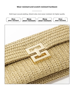 Detailed close-up of woven straw handbag featuring durable vacuum-plated gold metal buckle