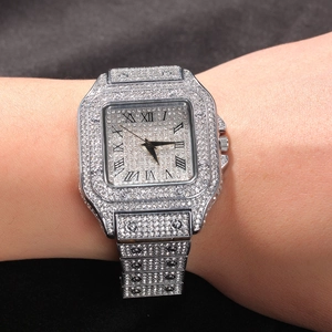 Detail of silver square quartz watch with iced-out rhinestones and Roman numerals