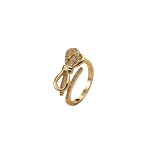 Elegant gold bow ring with sparkling zircon stones and adjustable open band design