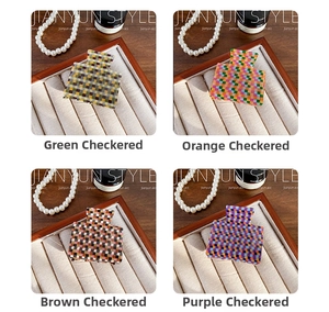 Various checkered pattern acrylic hair claws in green, pink, brown, and blue colors