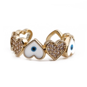 Detail of gold heart open ring with blue evil eye enamel and sparkling zircon stones