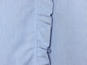 Detail of blue and white striped poplin fabric with vertical ruffled pleated decoration