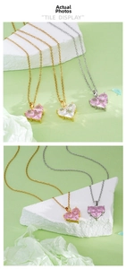 Detail view of 18K gold plated copper necklace with pink heart gemstone and prong setting