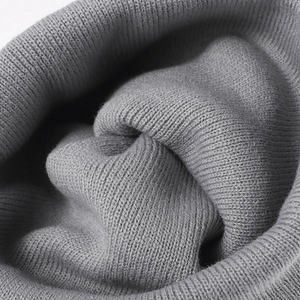 Close-up of high-quality double-layer thick knitted wool fabric in medium grey color