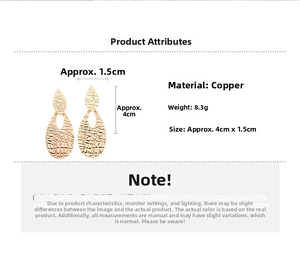 Macro detail of gold teardrop earrings with textured finish and precise dimensions