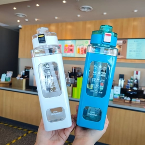 Close-up of 900ml square sports water bottles with time markers and straw lid design