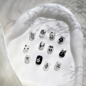 Black and white Christmas press-on nails with snowman, polar bear and 3D bow design