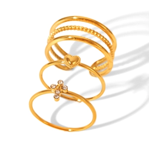 Three-piece gold plated ring set featuring heart, cross zircon, and layered band designs