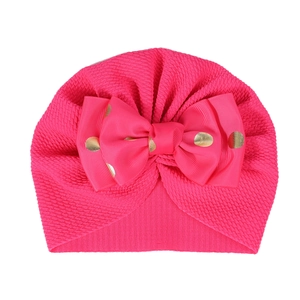 Rose red baby turban hat with a gold sequin polka dot bow and knitted texture