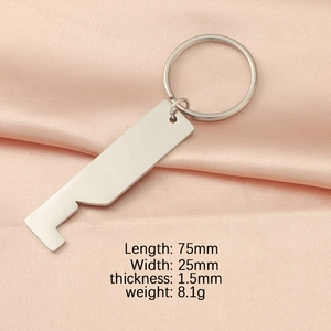 Detailed dimensions of silver stainless steel house puzzle keychain on pink silk background
