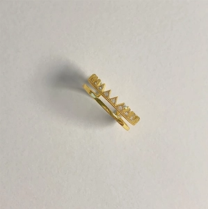 Detailed view of a gold double-layer ring featuring a crown zigzag pattern with zircons