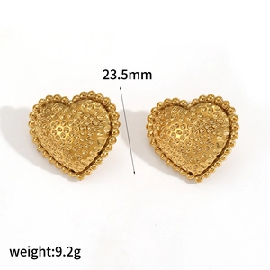 Detail view of 23.5mm gold heart stud earrings with hammered texture and beaded edges