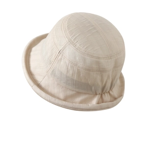 Minimalist beige cotton linen bucket hat with vertical texture and rolled brim for women