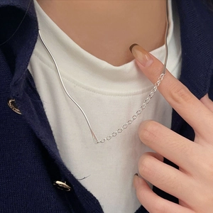 Minimalist 925 sterling silver necklace with irregular geometric lines on a female model