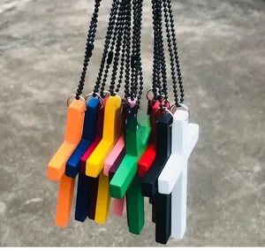 Close-up of colorful minimalist cross pendants on black beaded chains in various colors