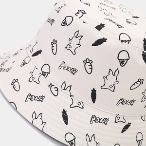 Detail shot of the cotton fabric texture and cartoon rabbit print on the bucket hat