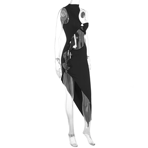 Detail of black cut-out dress with metal ring connectors and asymmetrical hemline