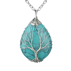 Handmade Tree of Life wire wrapped turquoise crystal pendant necklace on white background