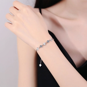 S925 sterling silver four-leaf clover bracelet with light blue round cut stones