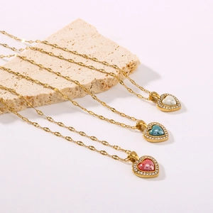 Gold heart necklaces with white blue and red enamel pendants and crystal borders