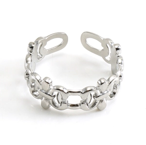 Macro detail of silver-tone hollow chain ring featuring an intertwined double-C design