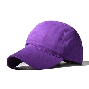 Close-up of deep purple cotton twill baseball cap with curved brim and 6-panel structure