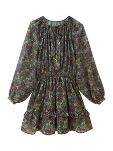 Detail of bohemian paisley print on mini dress with ruffled hem and elastic waist