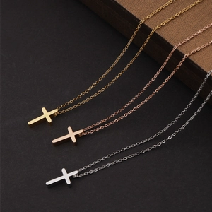 Polished stainless steel cross necklaces in gold, rose gold, and silver on O-chains