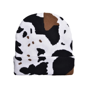 Detailed close-up showing the soft double-layer knit texture and cow print pattern