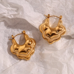 Macro detail of 18K gold plated stainless steel double layer lotus hollow earrings