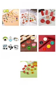Detailed collection of colorful enamel lapel pins with Chinese zodiac and cartoon motifs