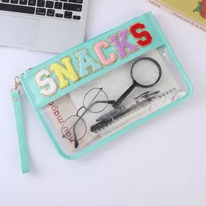Waterproof PVC makeup bag with mint green leather trim and SNACKS chenille letter patches
