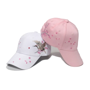 Pink and white baseball caps with crane and plum blossom embroidery in Chinese style