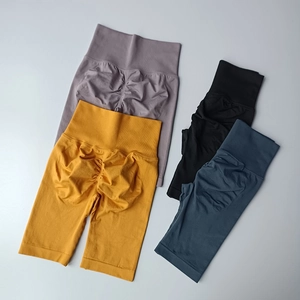 Detail of high-waist seamless scrunch butt fitness shorts in four vibrant colors