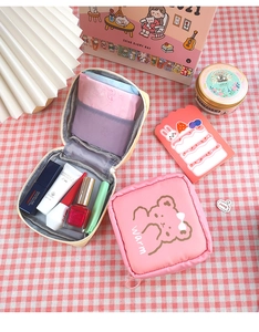 Detail showing inner mesh compartments and zipper of the cute bear storage pouch